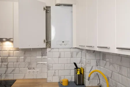 Gas boiler water heater installated in kitchen