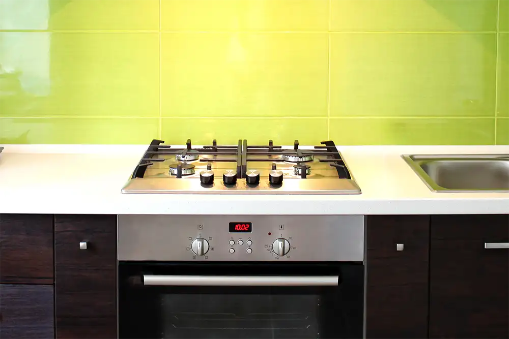 gas hob in a green kitchen