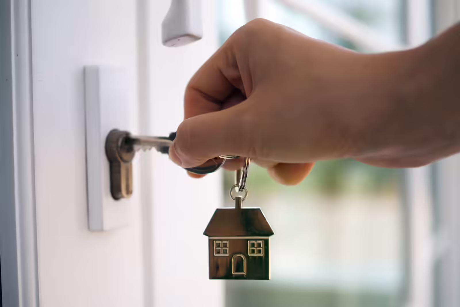 Landlord unlocks the house key for new home