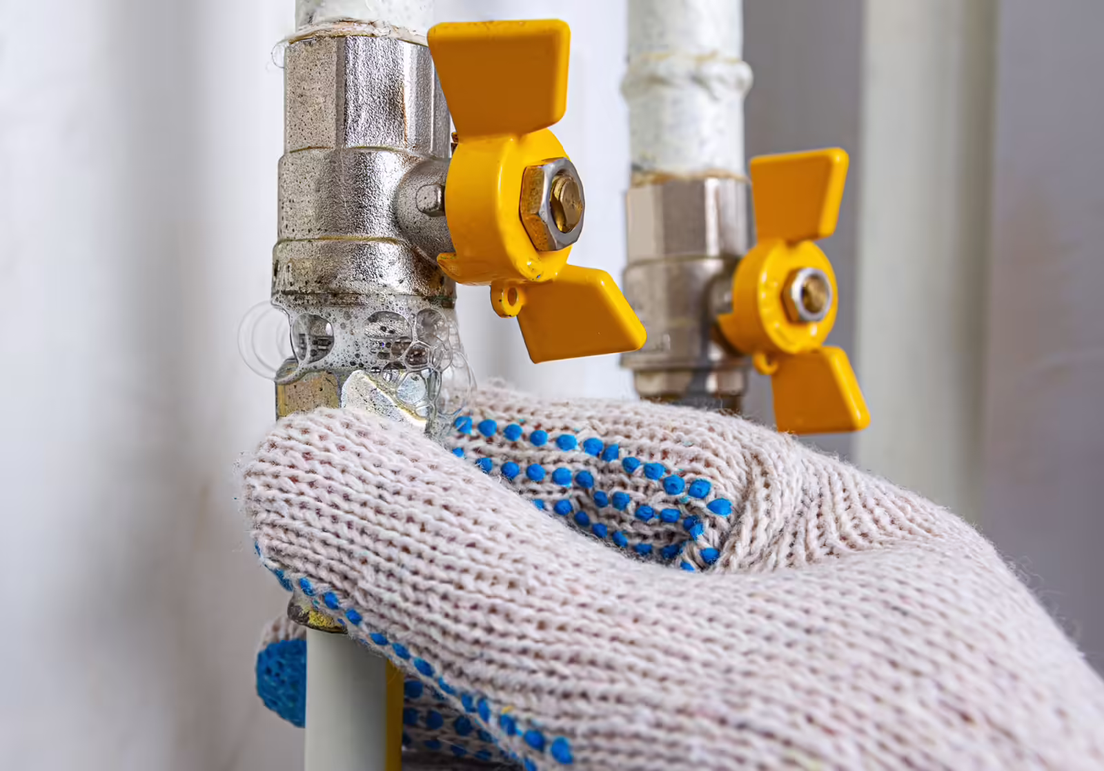 soap mixture applied to threaded joint on gas pipe indicate gas leak